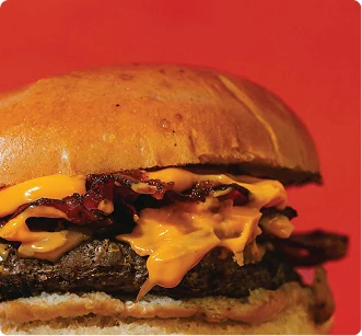 Cheeseburger close-up on a red background
