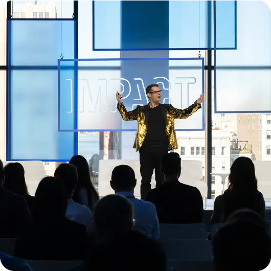Impact keynote speaker on stage