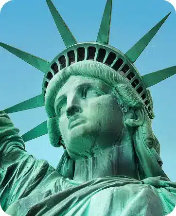Statue of Liberty close-up on blue background