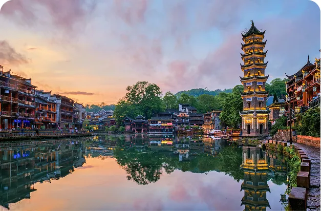 Fenghuang riverside pagoda at dusk, China