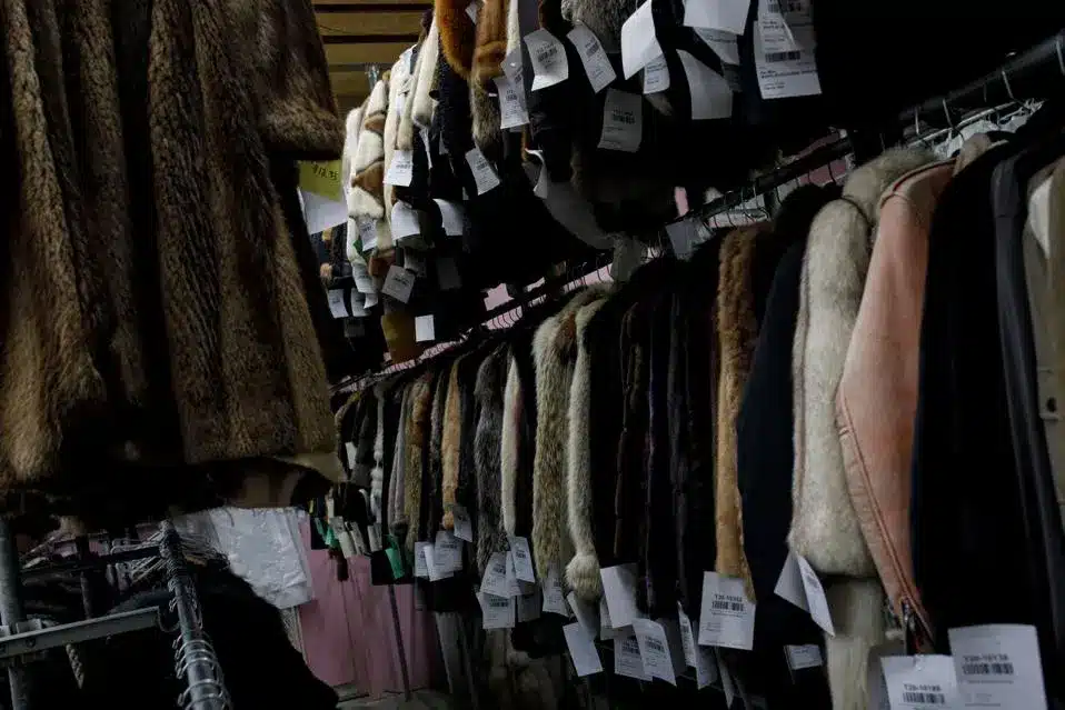 Fur coats hanging on a clothing rack