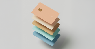 Pastel credit cards stacked on top of each other neatly.